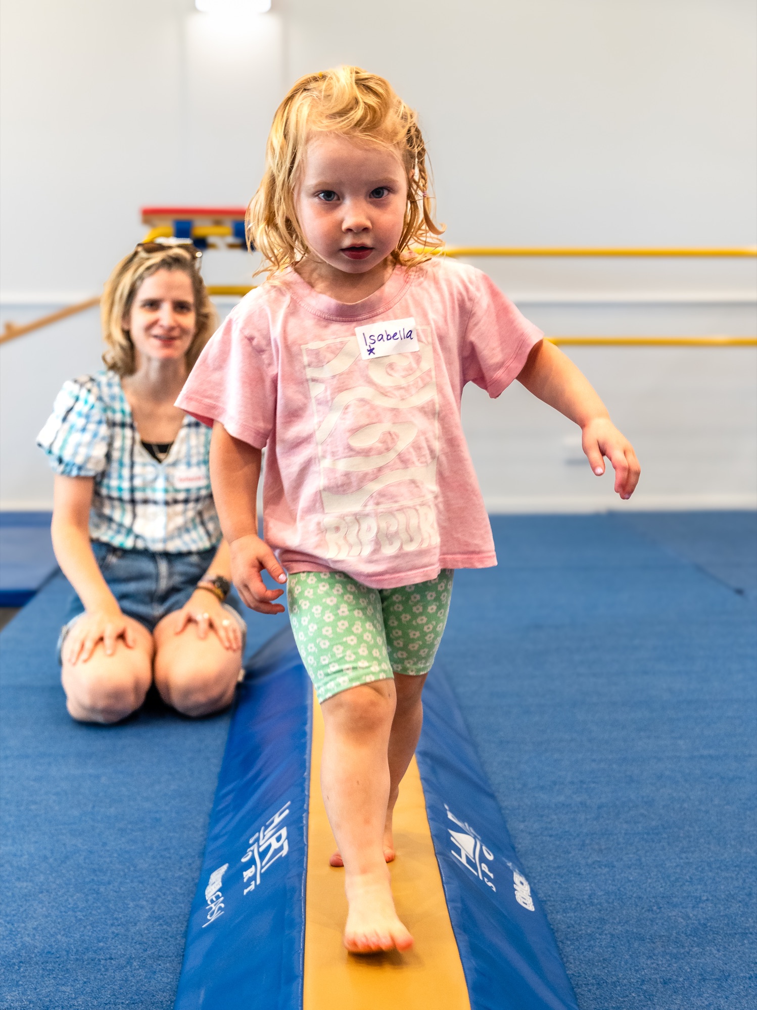 A little one walking the balance beam